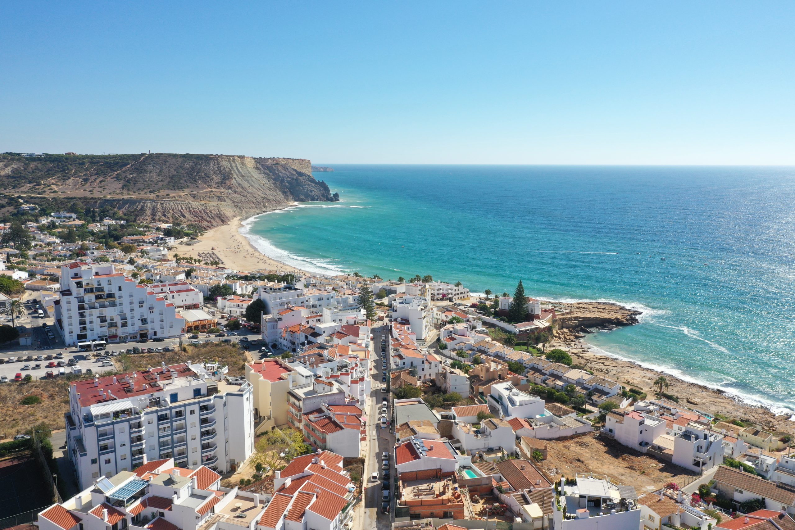 Drone view of beach and properties
