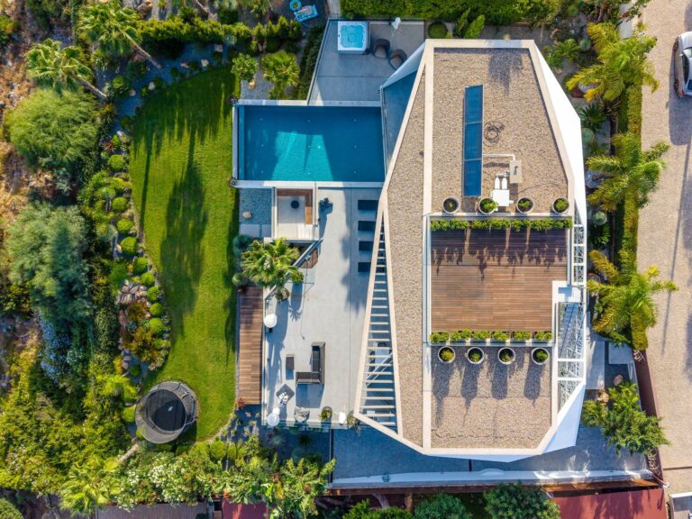 Aerial view of a modern villa with pool and garden in the Algarve
